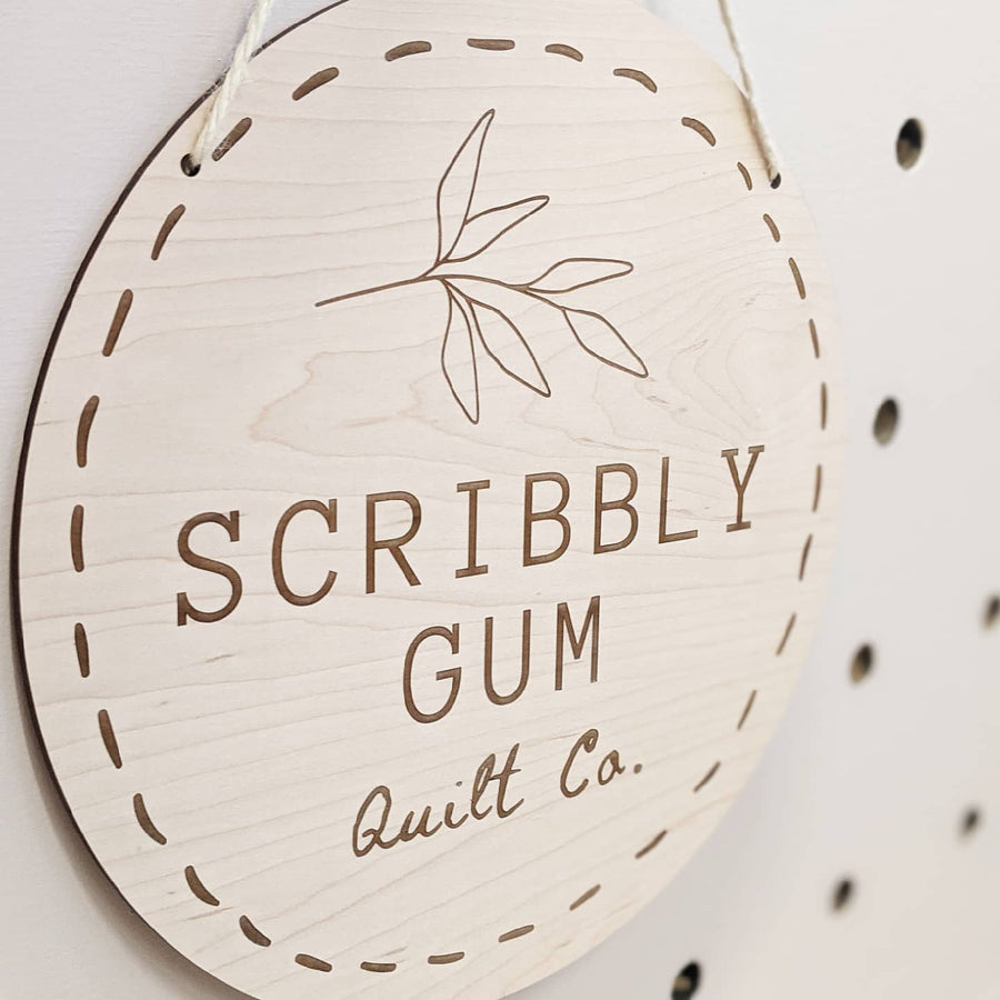 Gum leaf design on maple engraved sign