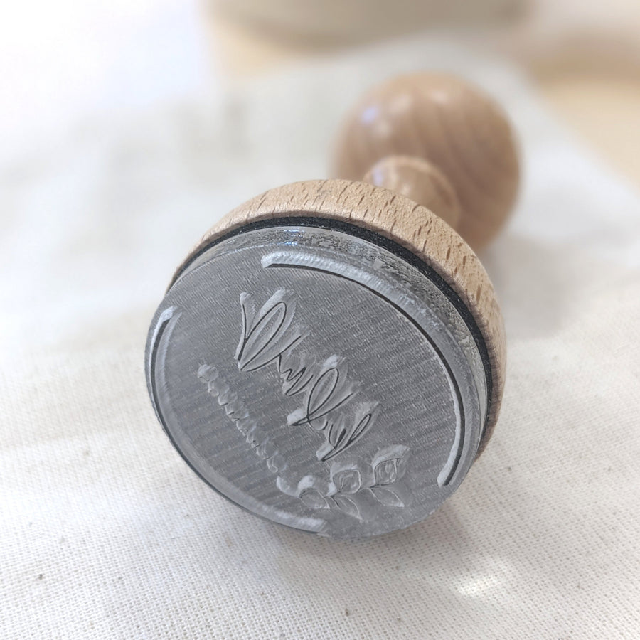 showing an engraved logo on an acrylic soap stamp