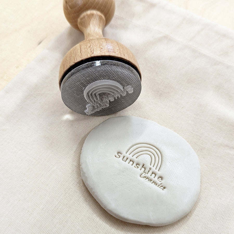 Acrylic pottery stamp with an impression in clay