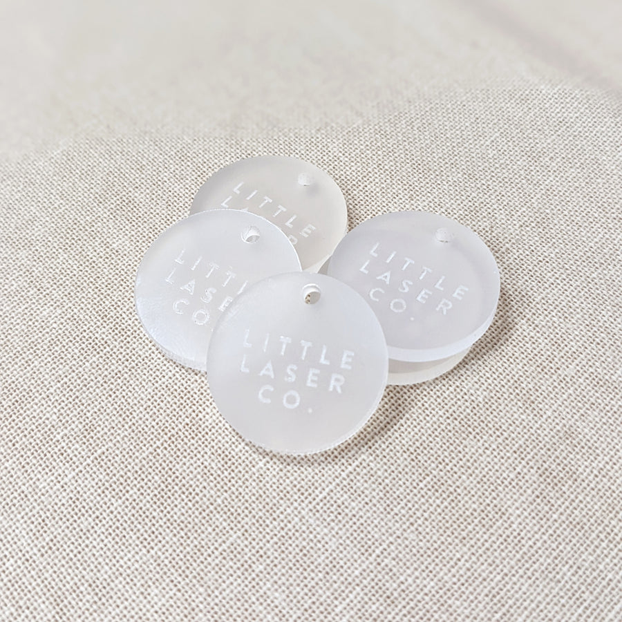 Frosted acrylic circle tags on fabric