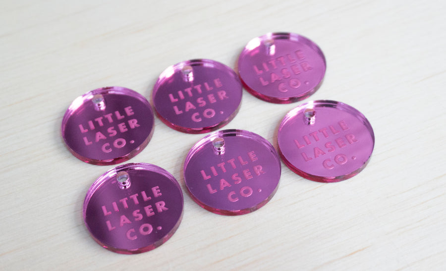 Laser engraved pink mirror tags